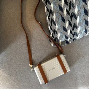 Rimowa crossbody in Aluminum / Silver with brown leather strap